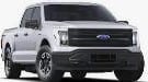 A white Ford pickup truck with four doors is parked, shown from the front-left side.