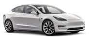 A white, four-door Tesla Model 3 electric car is shown from the front-side angle against a plain background.