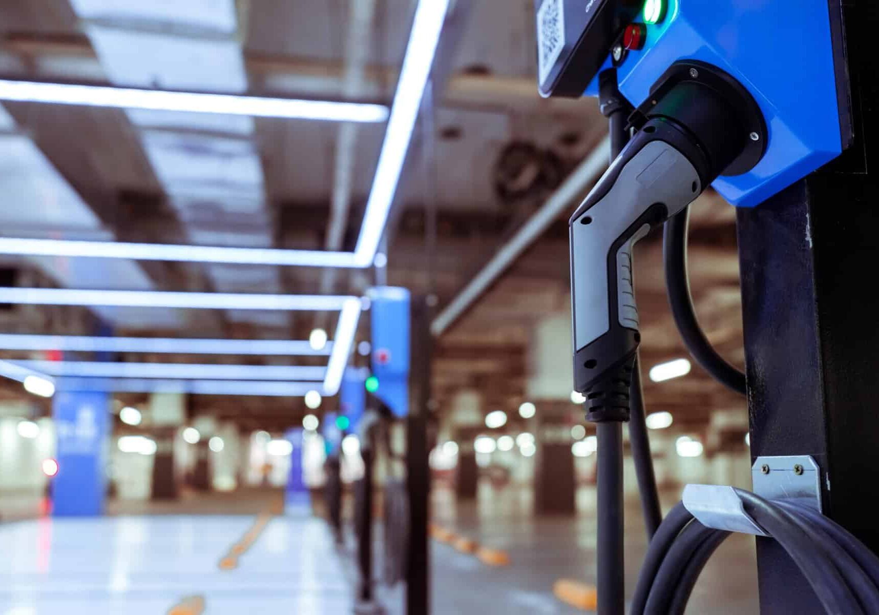 An electric car charging station in a parking garage offering convenient charging for GOEVIN vehicles.